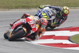 Honda MotoGP rider Marc Marquez (front) of Spain and Yamaha MotoGP rider Valentino Rossi of Italy ride during the Malaysian Motorcycle Grand Prix at Sepang International Circuit near Kuala Lumpur, Malaysia, October 25, 2015. REUTERS/Olivia Harris