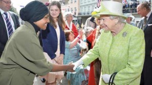 Britain's Queen Elizabeth greets Nadiya Hussain, winner of the Great British Bake Off who baked a cake for her as she walks through Windsor on her 90th Birthday, in Windsor, Britain April 21, 2016. REUTERS/John Stillwell/Pool